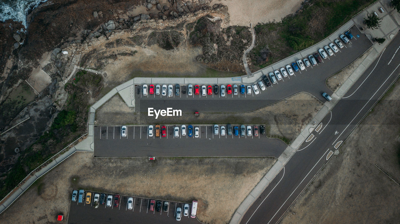 Aerial view of cars parked on road