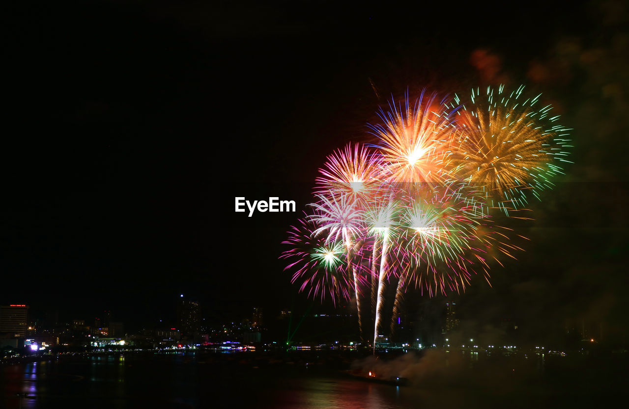 Fantastic multi-color fireworks splashing in the night sky
