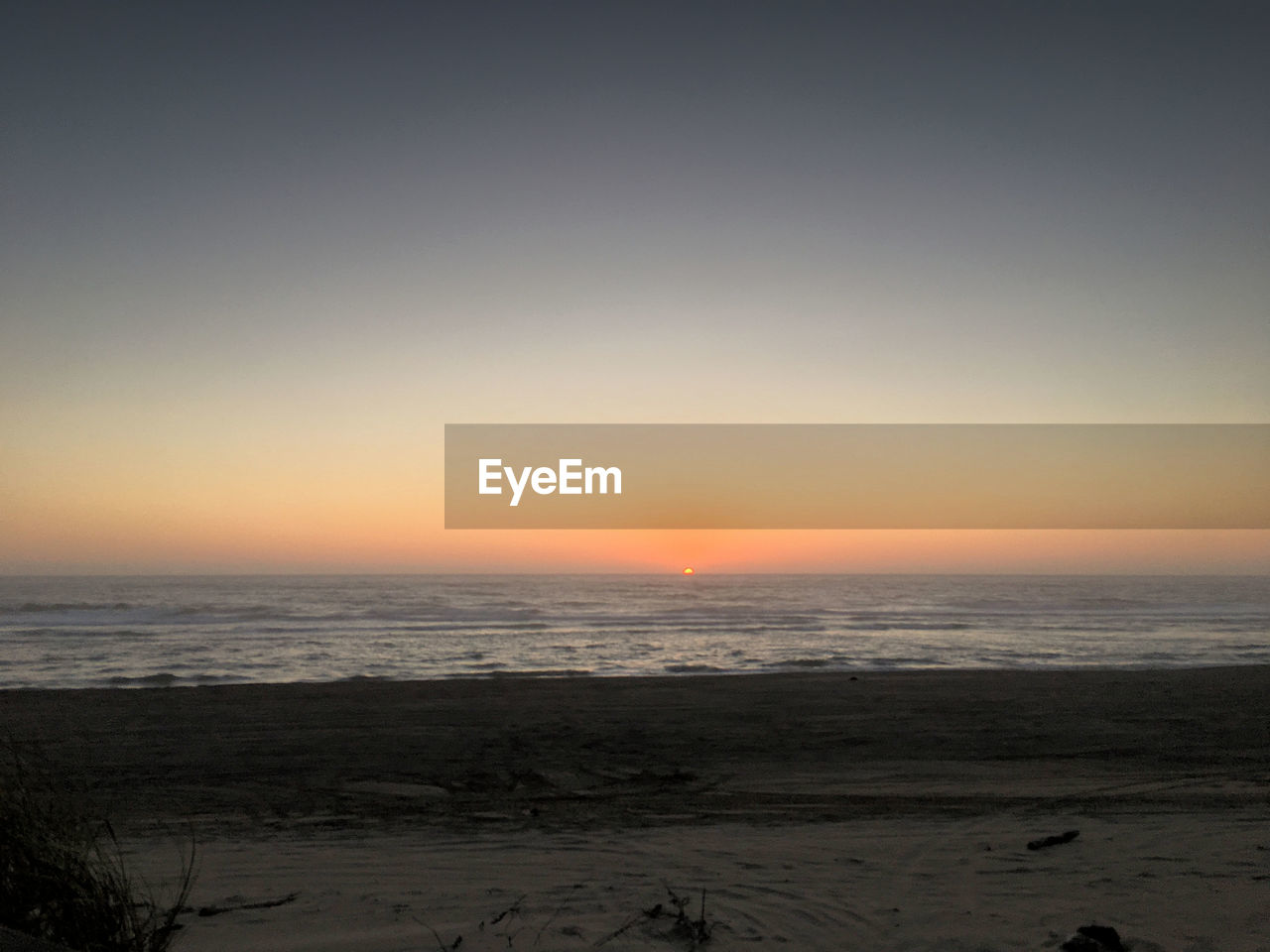 SCENIC VIEW OF SEA DURING SUNSET