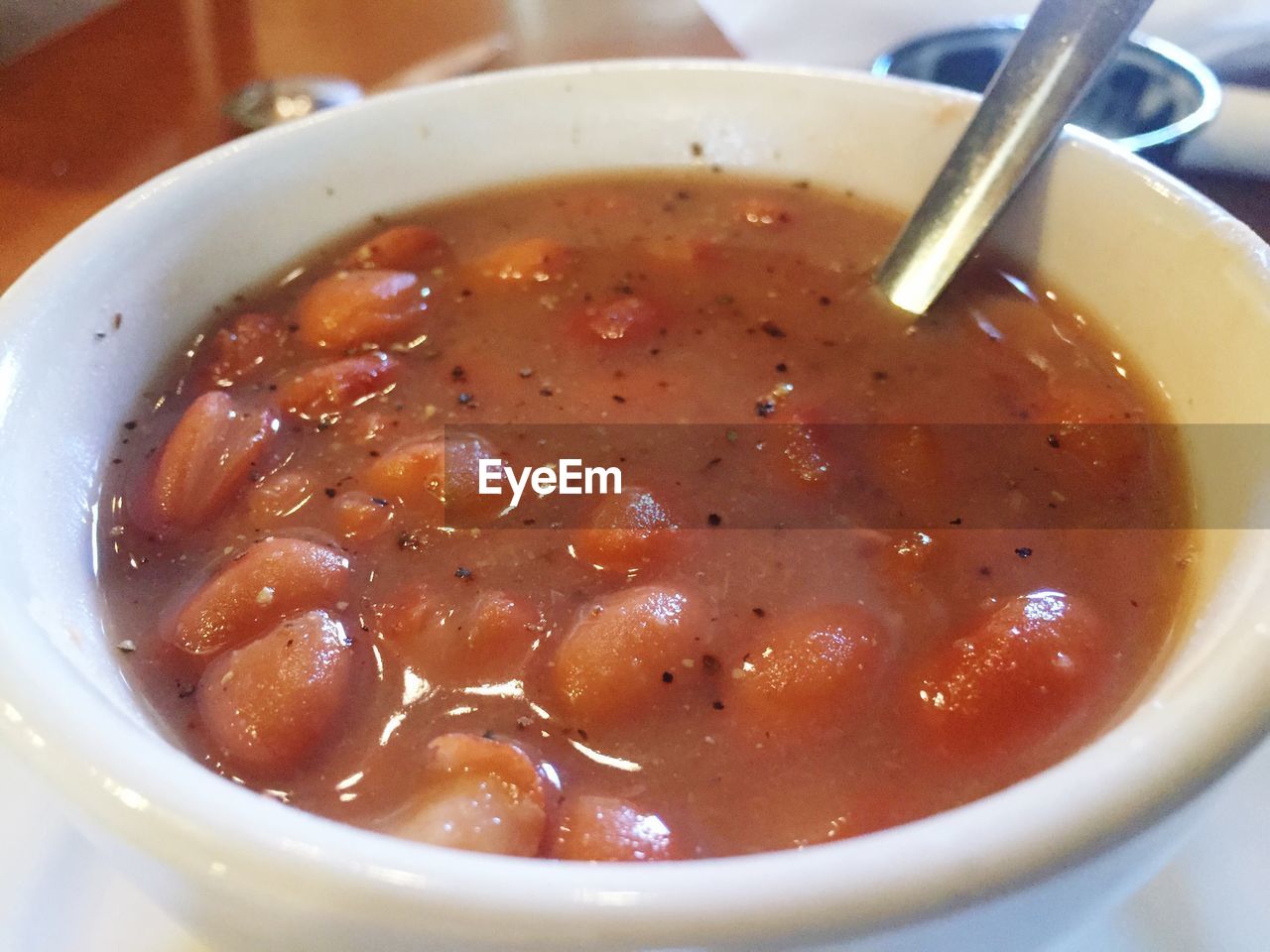 High angle view of pinto bean soup served in bowl on table