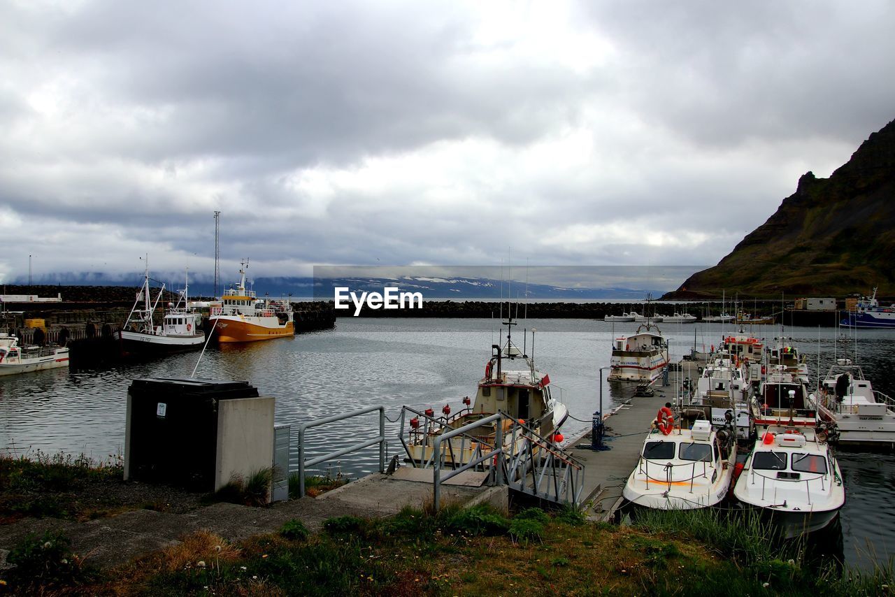 VIEW OF BOATS MOORED IN HARBOR