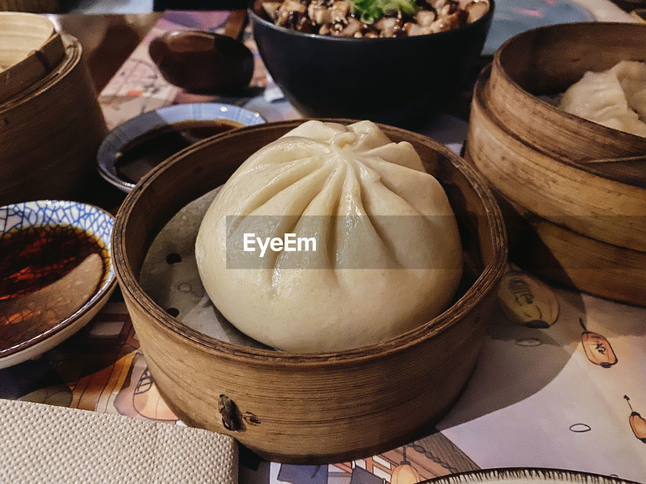 dim sum, food and drink, xiaolongbao, food, chinese food, asian food, dumpling, chinese dumpling, container, buuz, freshness, wellbeing, healthy eating, steamed, dish, no people, still life, basket, cuisine, bamboo - material, siopao, high angle view, indoors, bowl