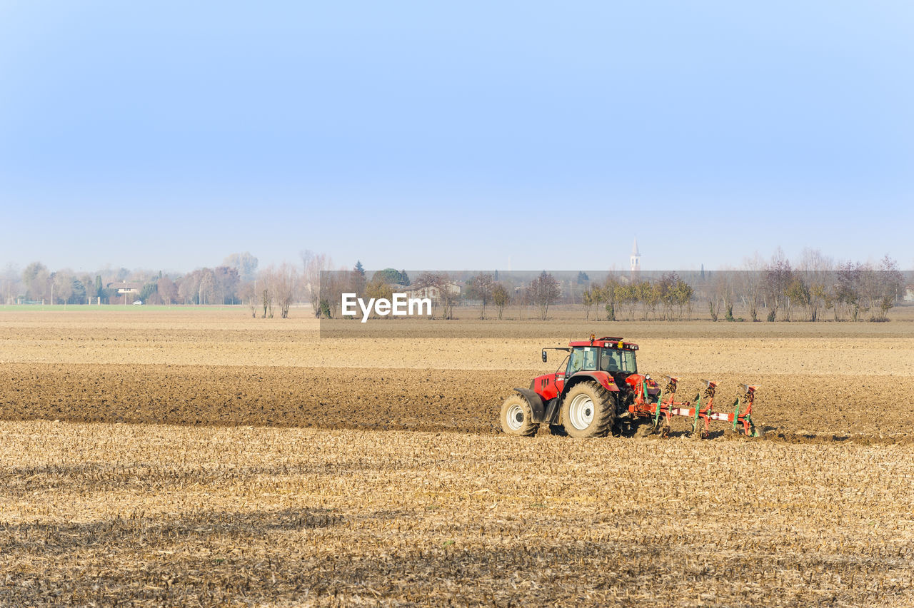 AGRICULTURAL FIELD AGAINST CLEAR SKY