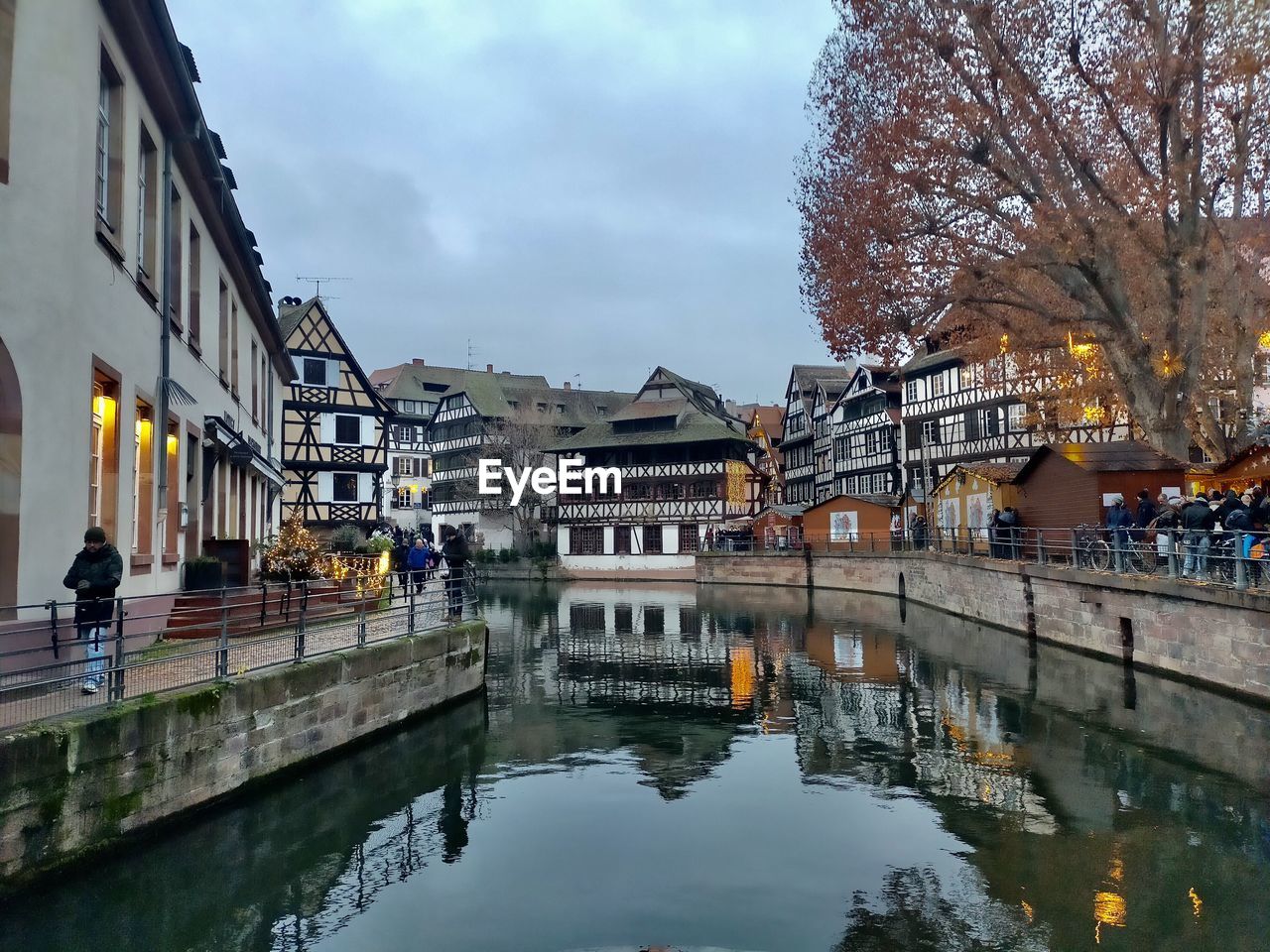 architecture, water, built structure, building exterior, reflection, city, canal, town, waterway, cityscape, nature, building, sky, travel destinations, cloud, tourism, tree, travel, urban area, waterfront, bridge, outdoors, street, residential district, city life, plant, transportation, history, group of people, the past, day, body of water