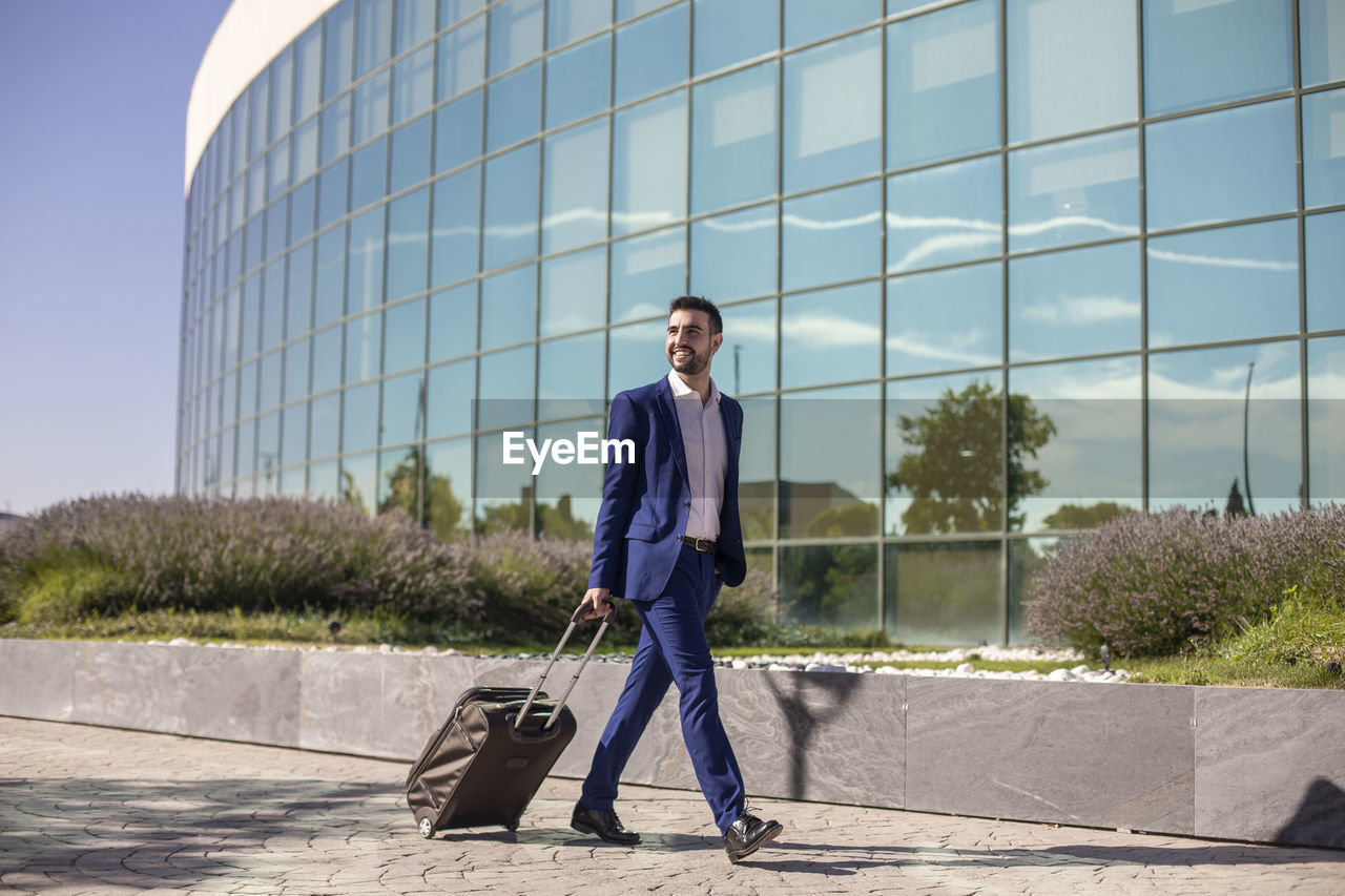 Businessman with suitcase taking a business trip