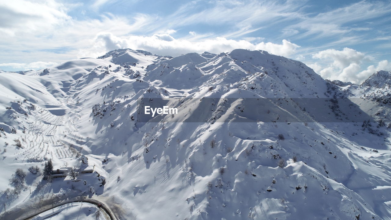 Scenic view of snowcapped mountains against sky