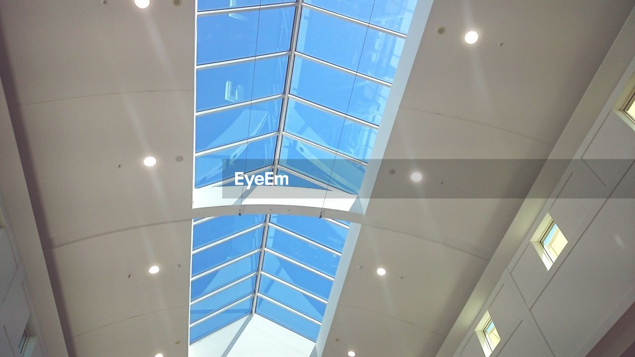 LOW ANGLE VIEW OF ILLUMINATED SKYLIGHT