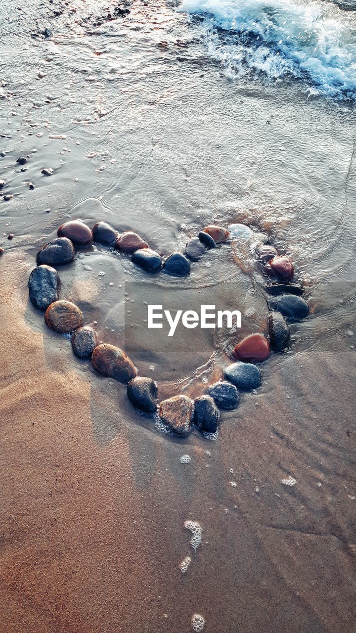 High angle view of pebbles on beach