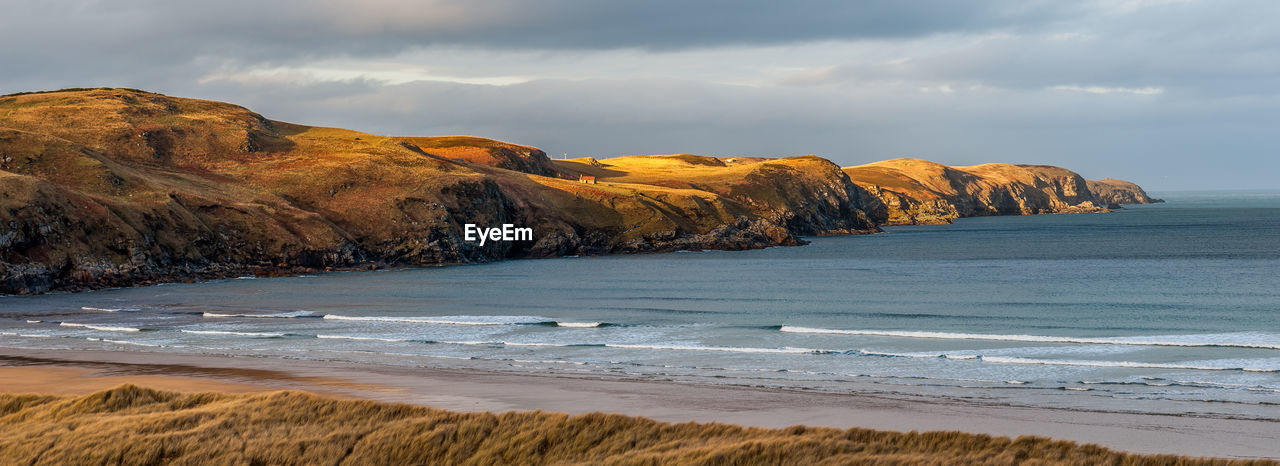 Strathy bay in sutherland located on the north coast of scotland and well known as a surfing beach