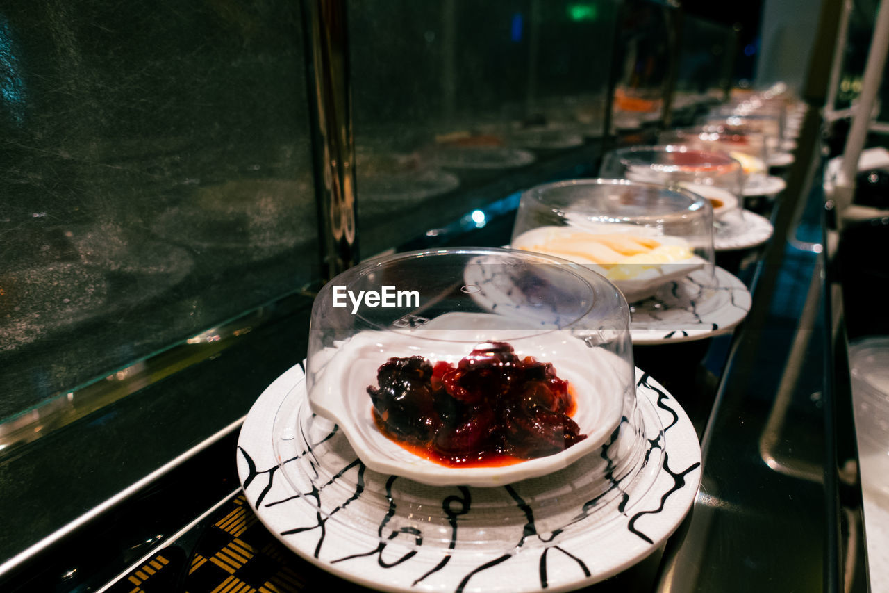 food and drink, food, freshness, meal, restaurant, healthy eating, plate, table, indoors, dessert, no people, fruit, sweet food, wellbeing, sweet, high angle view, household equipment, glass, cake, kitchen utensil