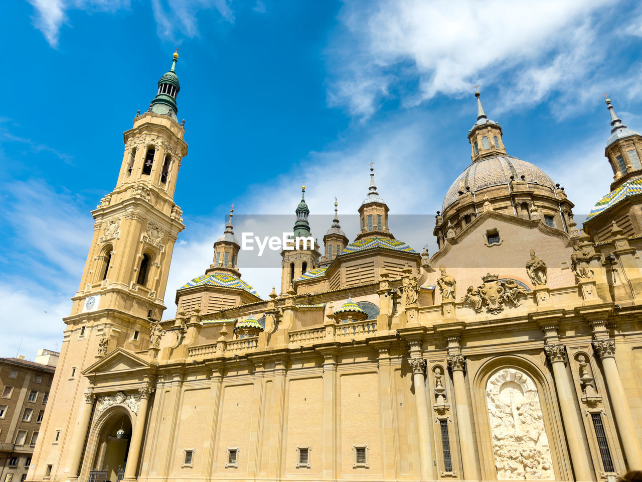 architecture, building exterior, built structure, travel destinations, sky, religion, landmark, worship, travel, place of worship, building, belief, history, city, the past, cloud, nature, spirituality, tourism, low angle view, blue, tower, facade, dome, no people, outdoors, day, historic site, catholicism, sunlight