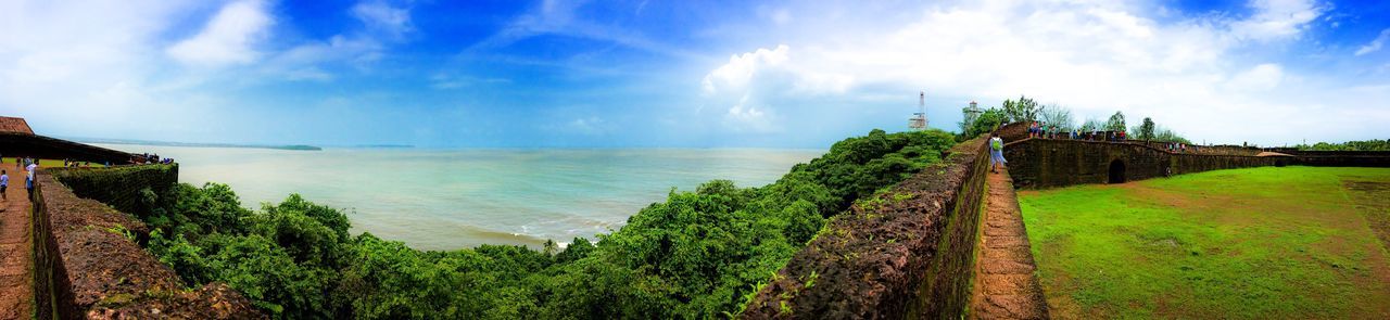 PANORAMIC VIEW OF SEA AND TREES AGAINST SKY