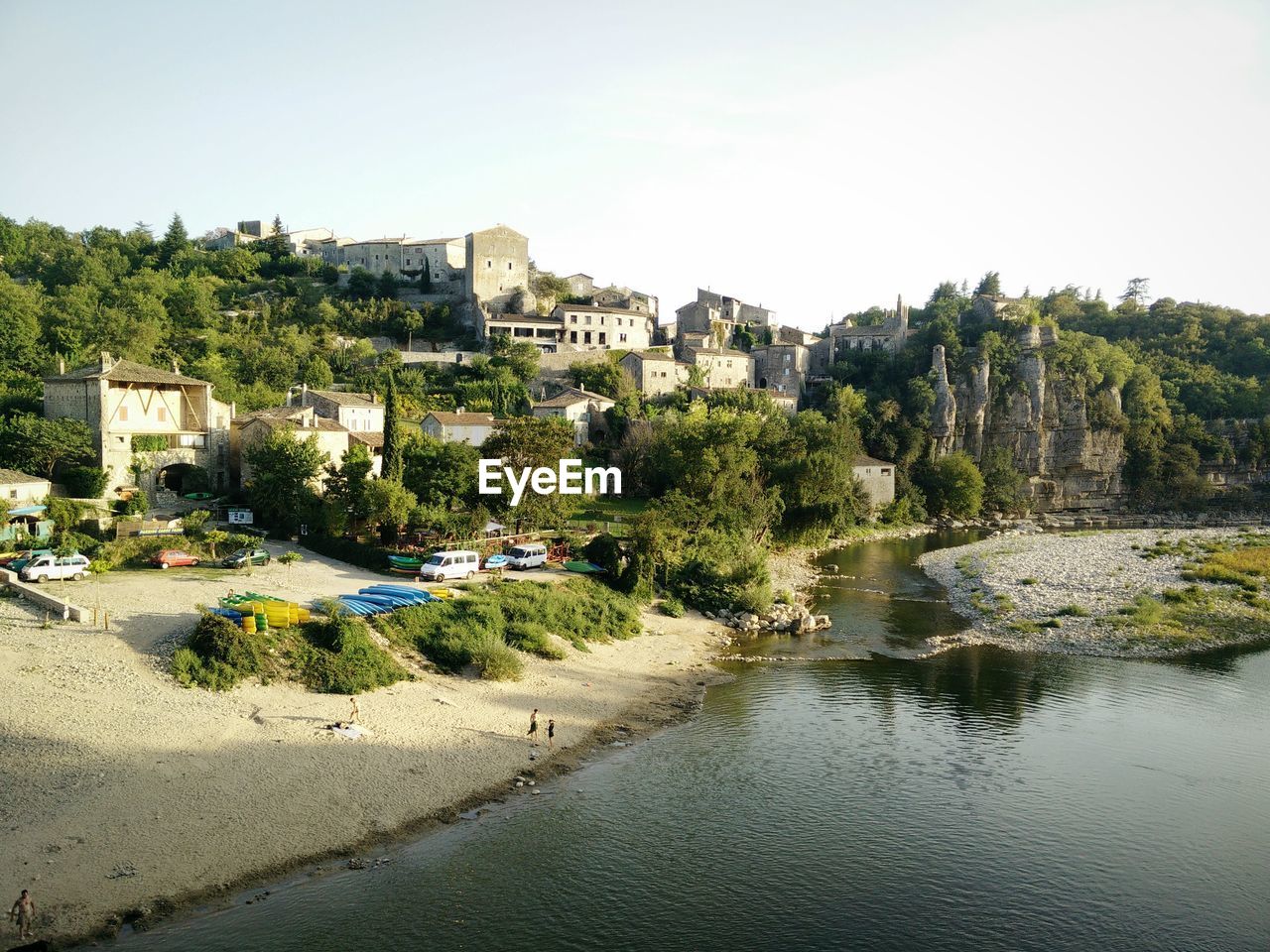 Beach by buildings against sky in city