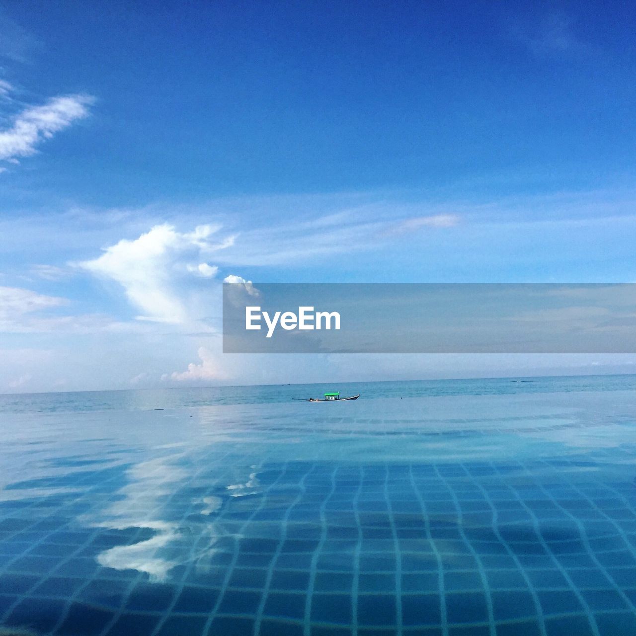 Scenic view of sea against blue sky