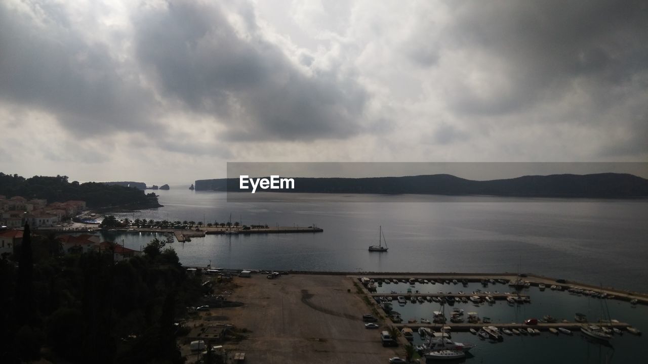 Sea and mountains against cloudy sky at pylos