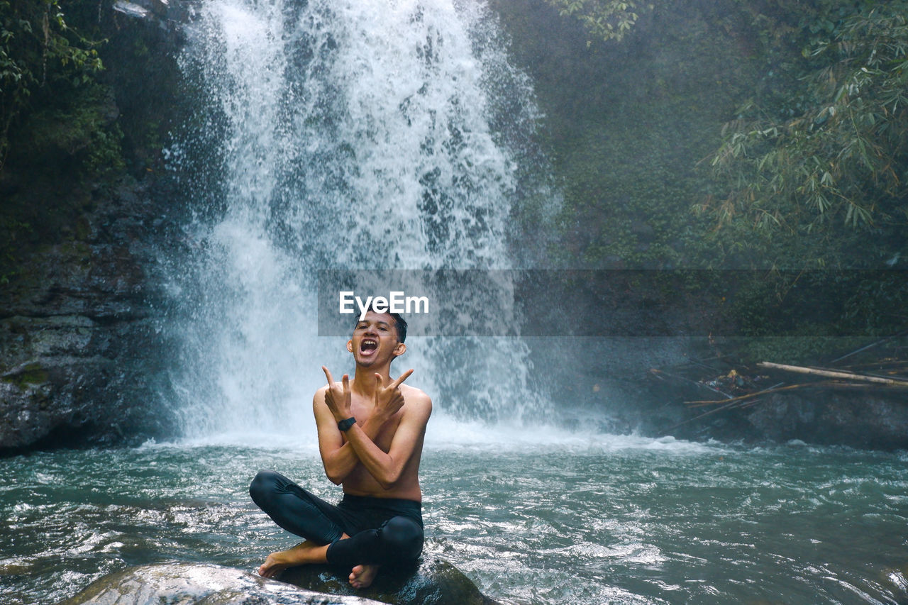 Playing in the waterfall