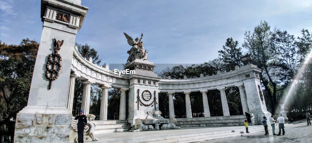 LOW ANGLE VIEW OF SCULPTURES AGAINST SKY