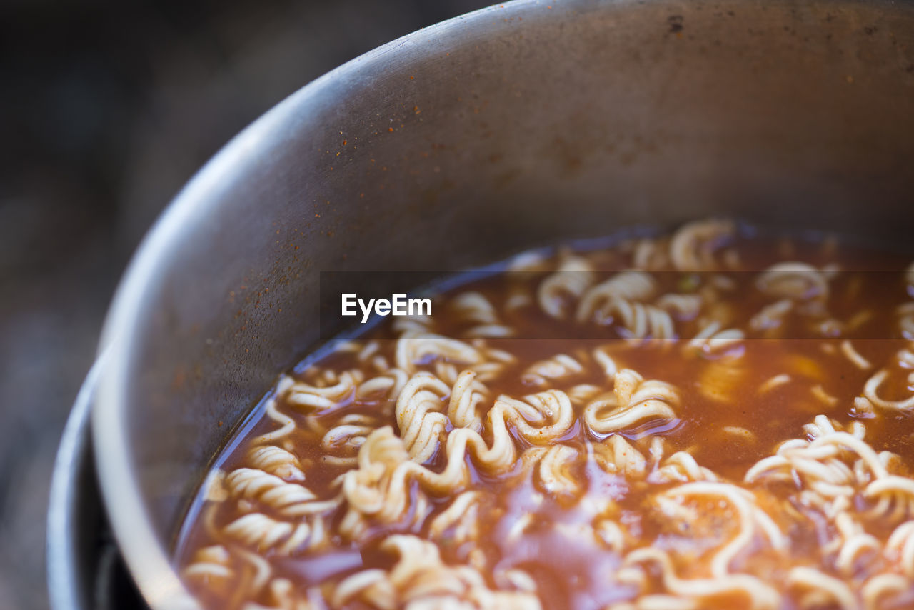Close-up of noodles in bowl at campsite