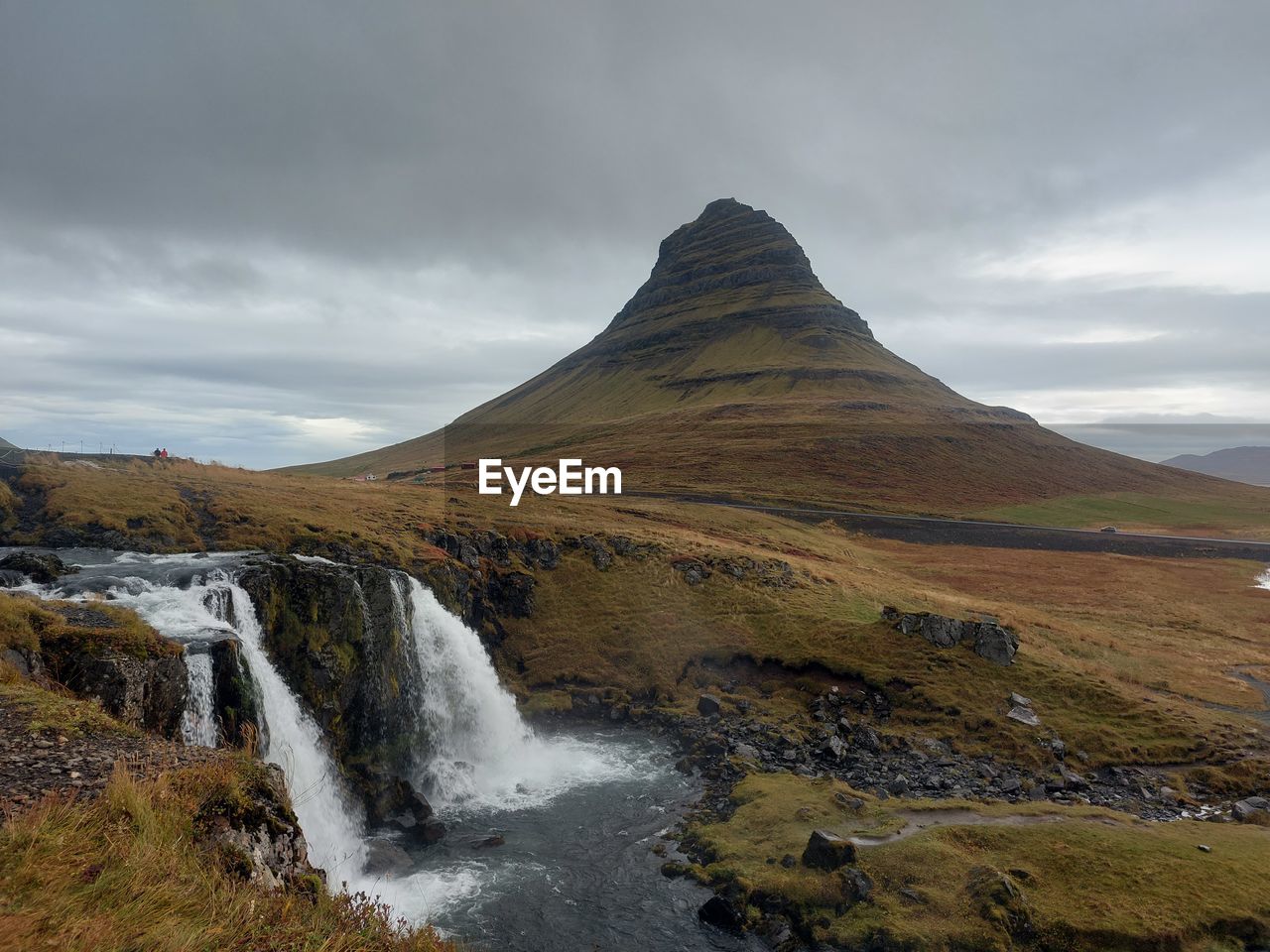 scenic view of waterfall against sky