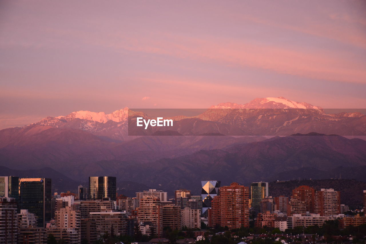 High angle view of buildings against sky at sunset