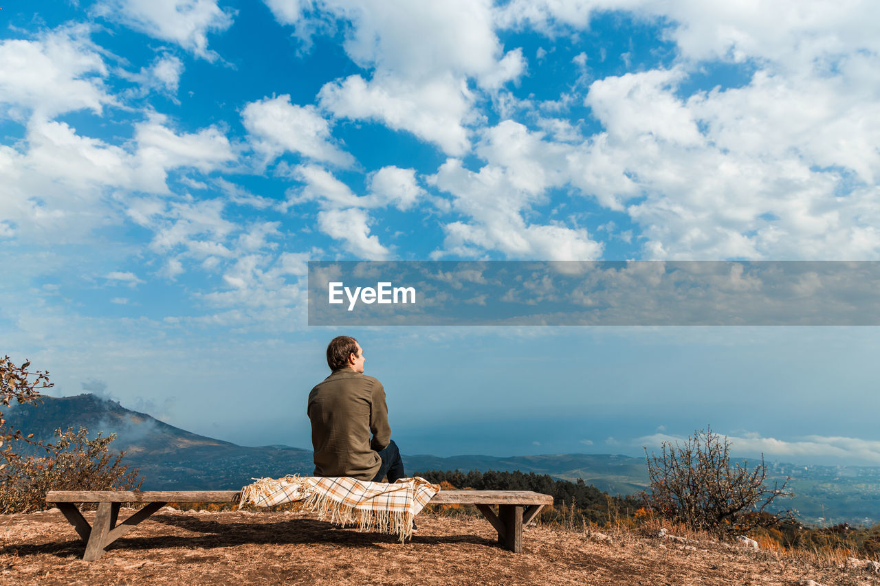 Man sitting on a rock