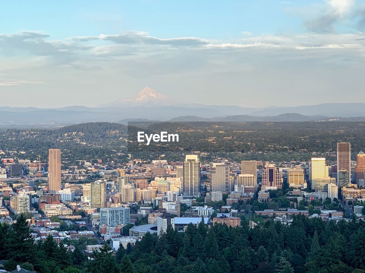 High angle view of city buildings against sky with mount hope peak view