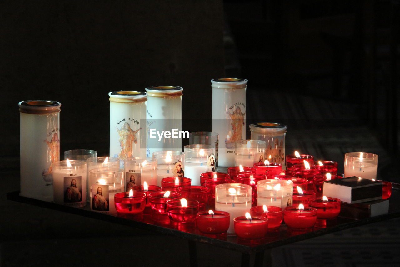 CLOSE-UP OF CANDLES ON TABLE