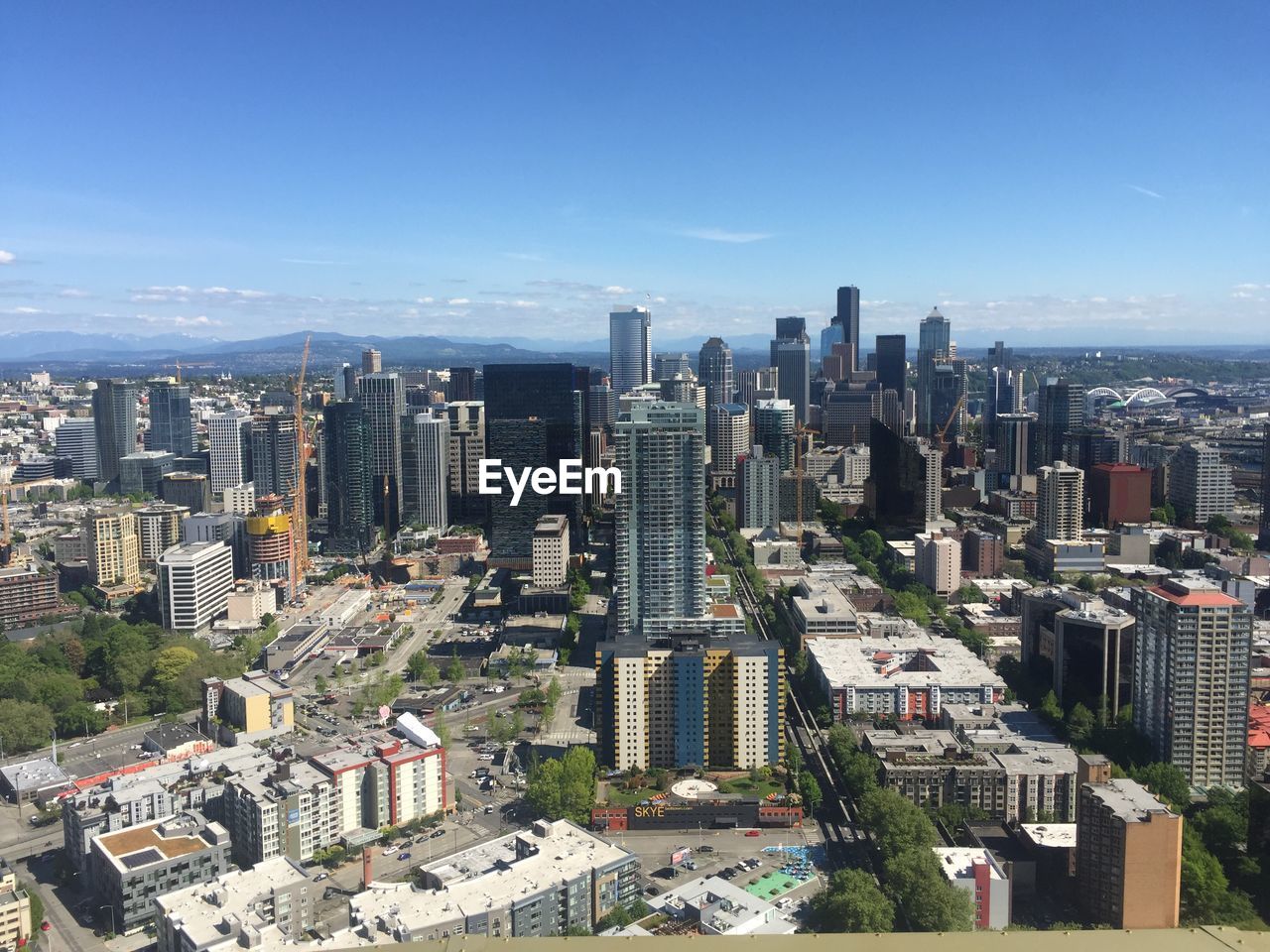 High angle view of modern buildings in city against sky