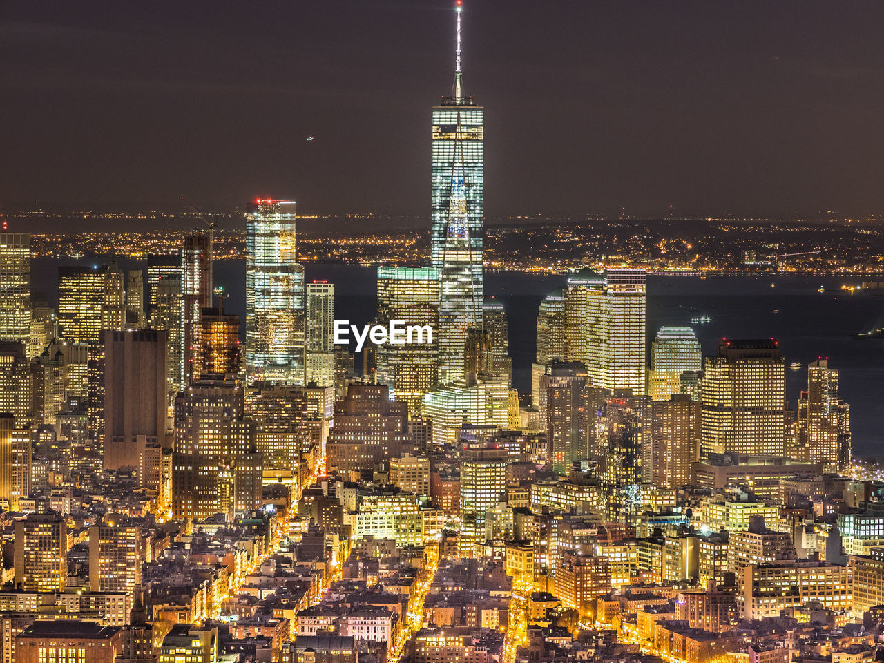 AERIAL VIEW OF ILLUMINATED BUILDINGS IN CITY