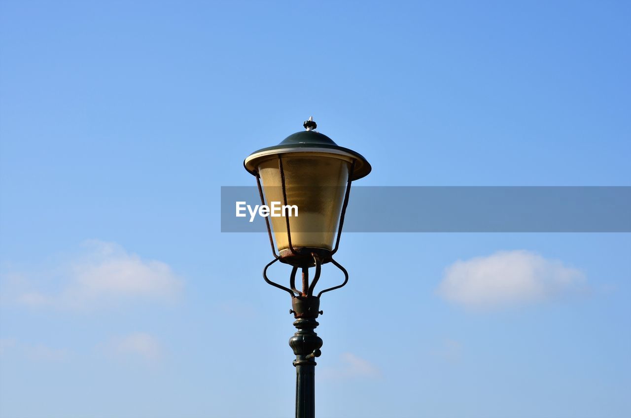 STREET LIGHT AGAINST BLUE SKY