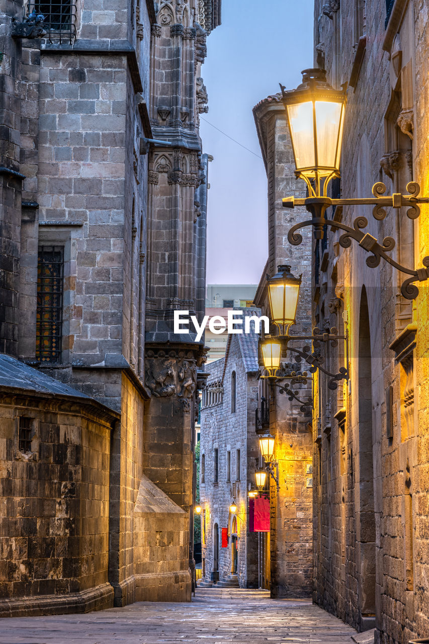 Small alley in the famous gothic quarter in barcelona at dawn