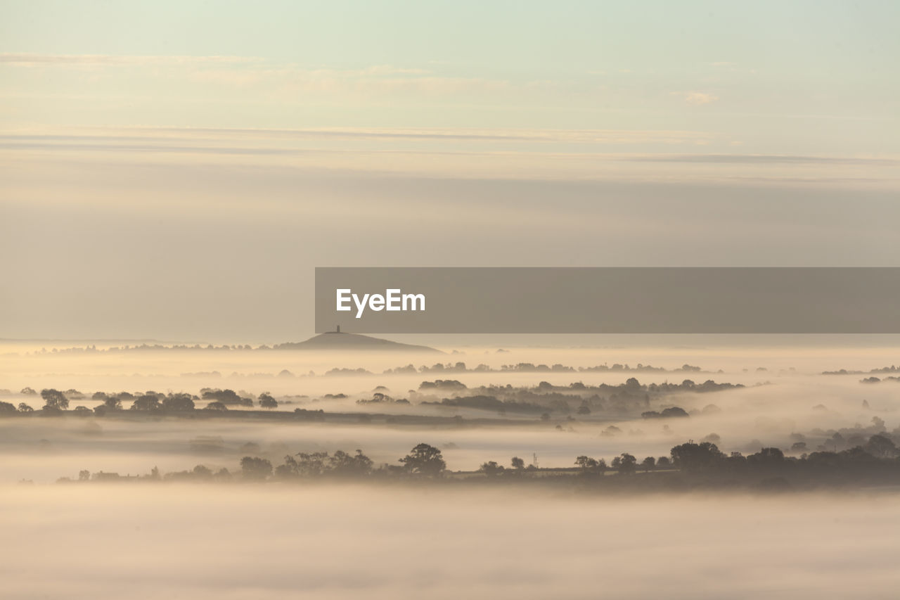 Scenic view of landscape against sky during sunset