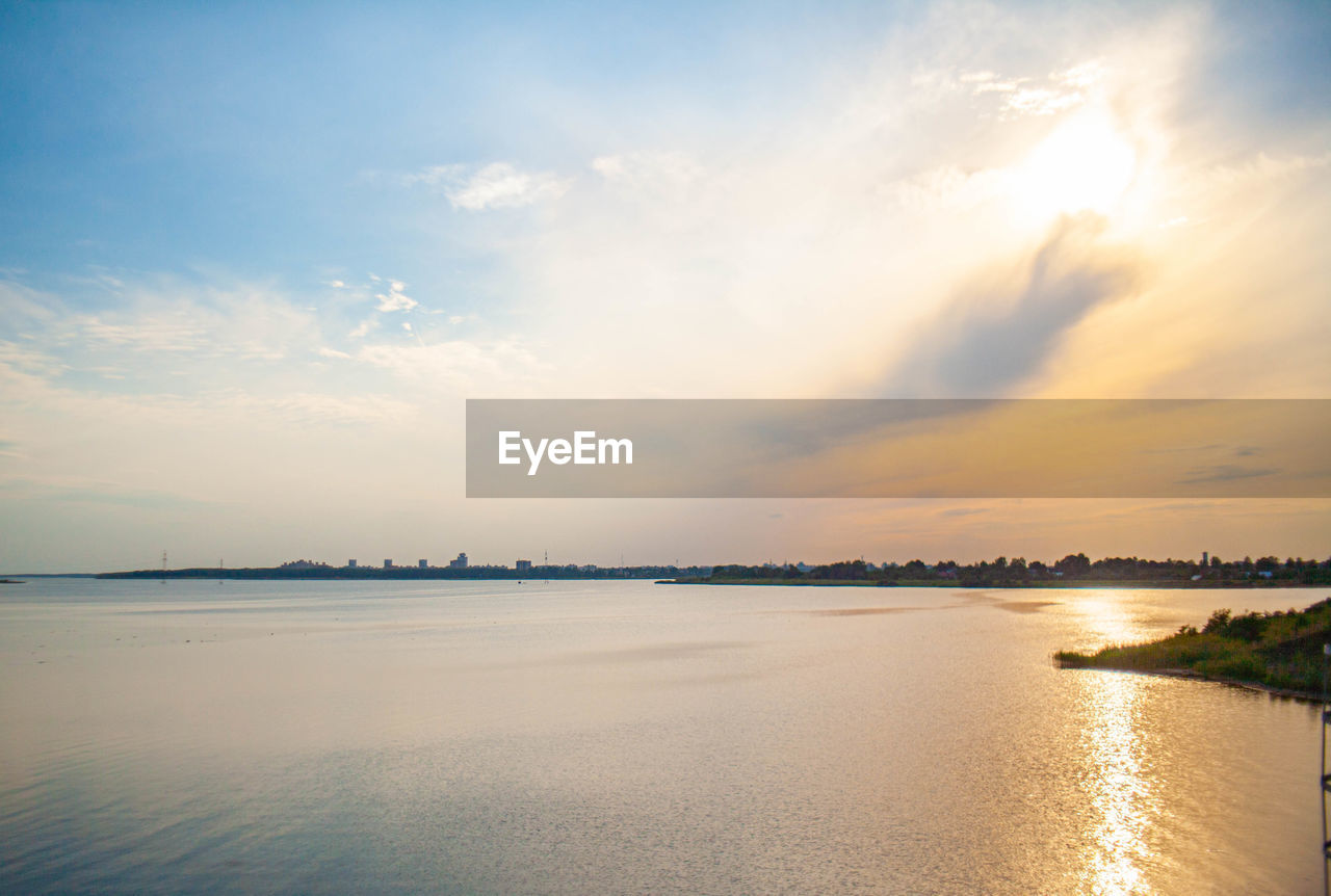 SCENIC VIEW OF BEACH DURING SUNSET