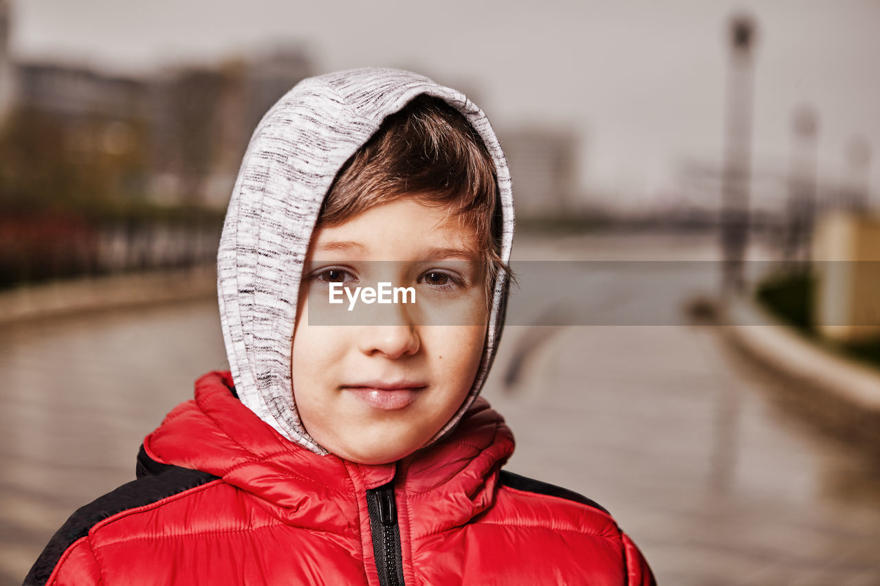 PORTRAIT OF SMILING BOY IN WINTER