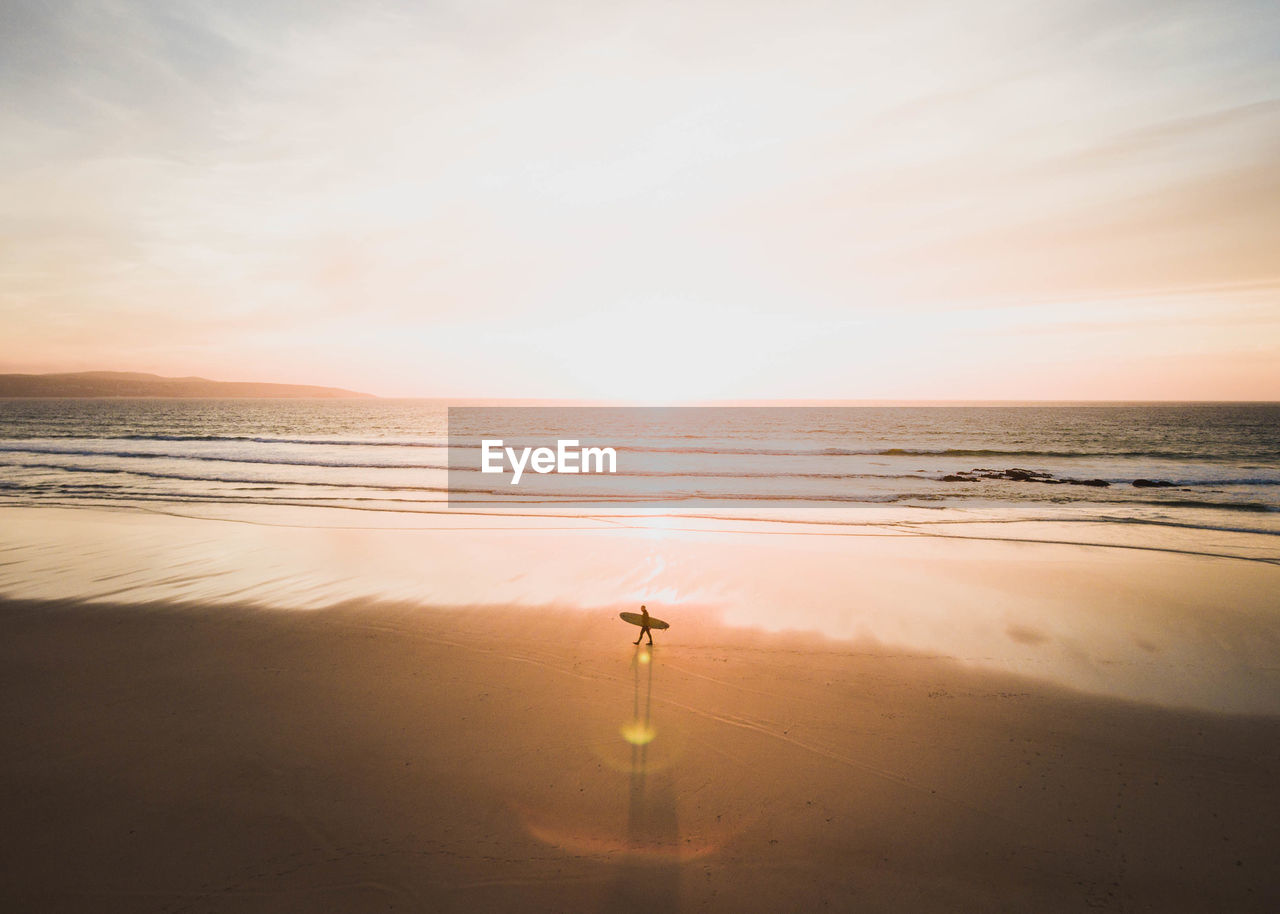 Scenic view of sea against sky at sunset