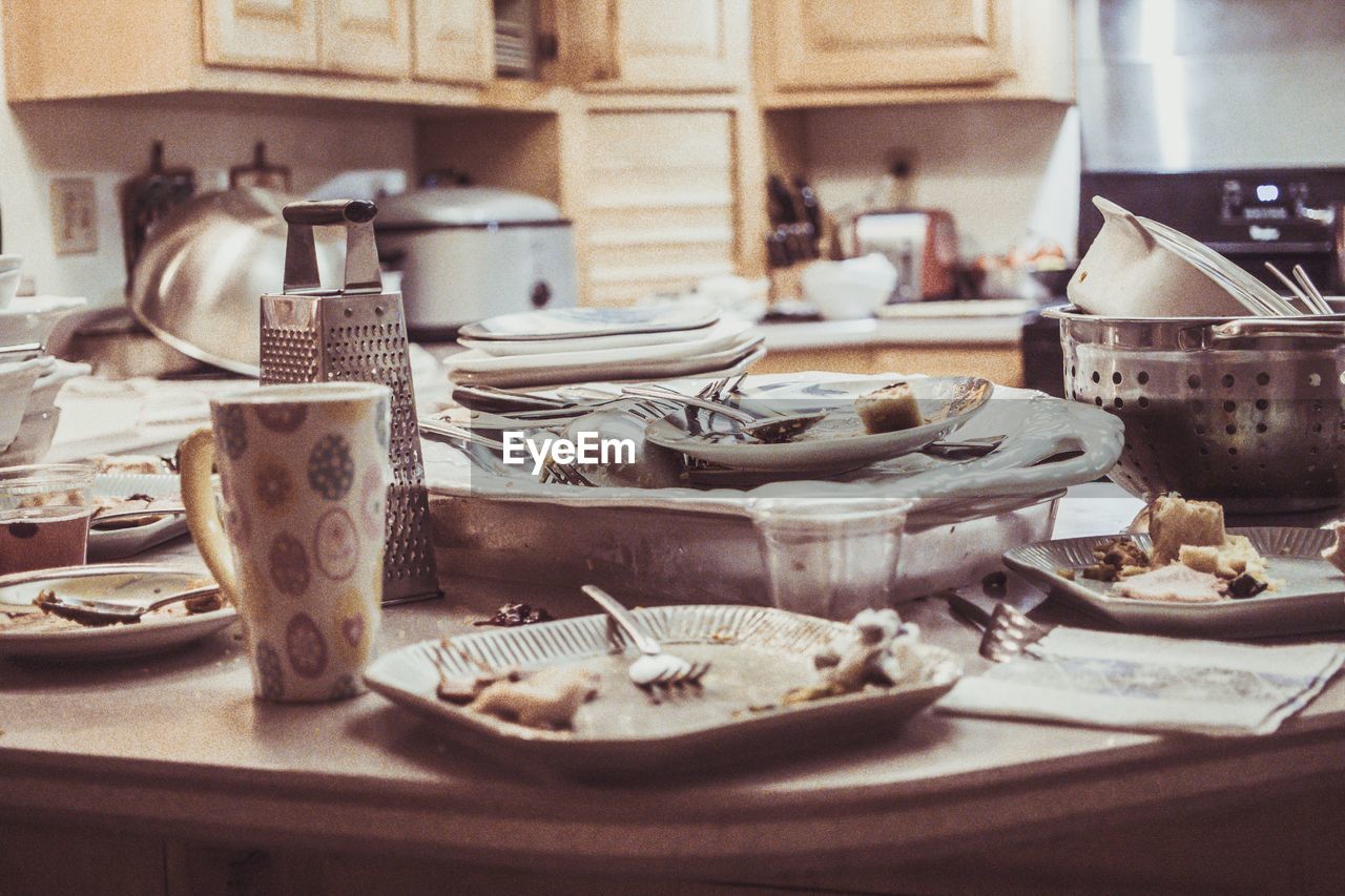 Close-up of dirty dishes on counter at home