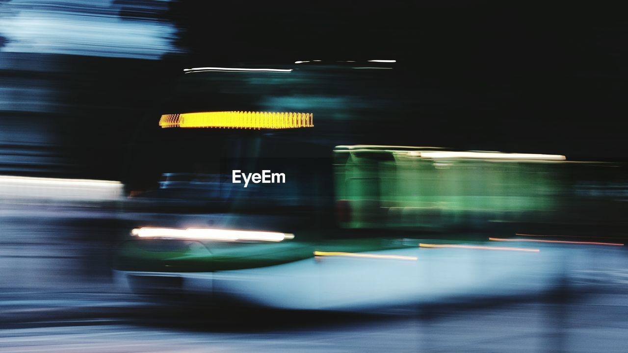 Blurred motion of bus on road