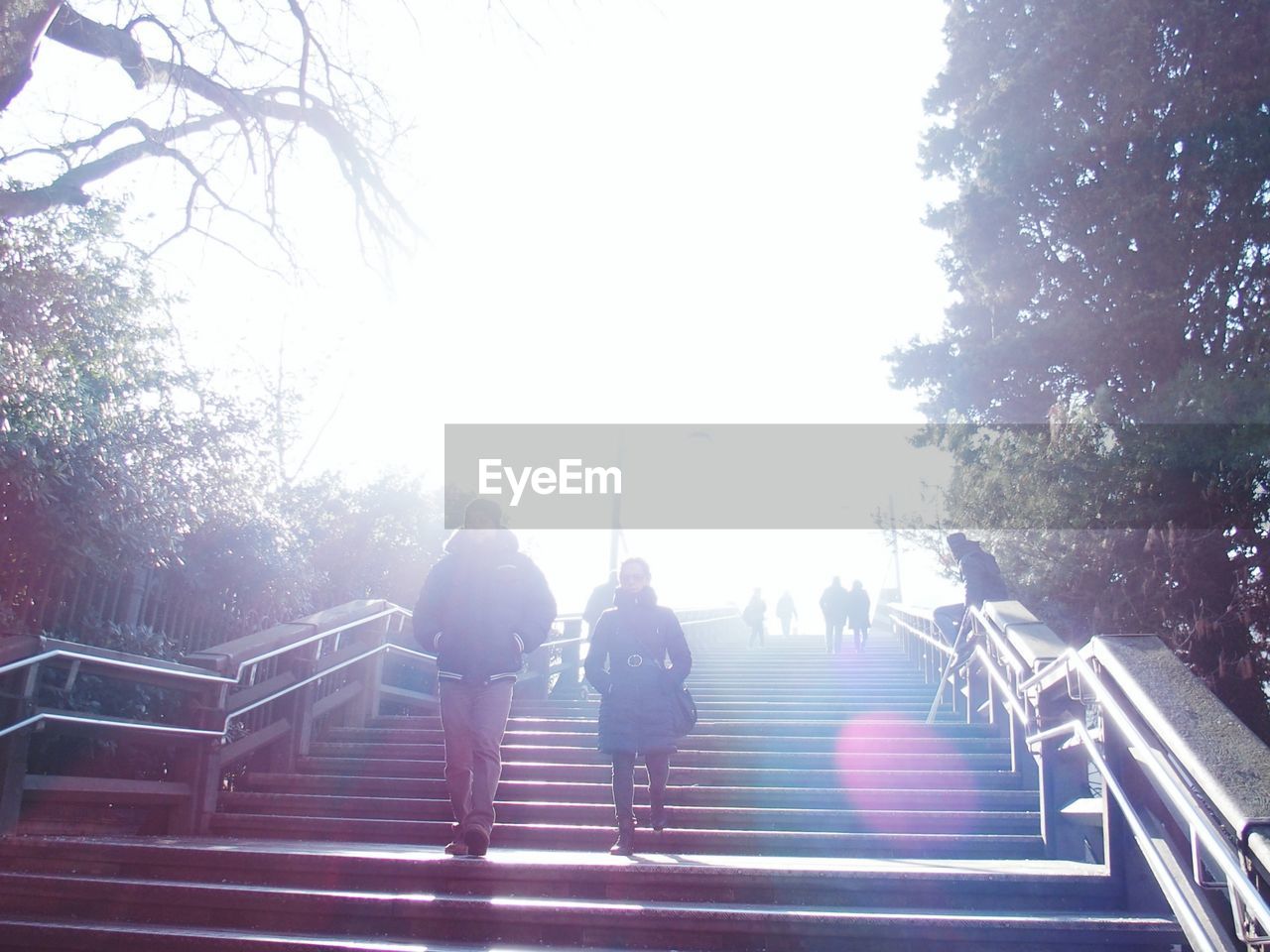 WOMAN STANDING ON STEPS