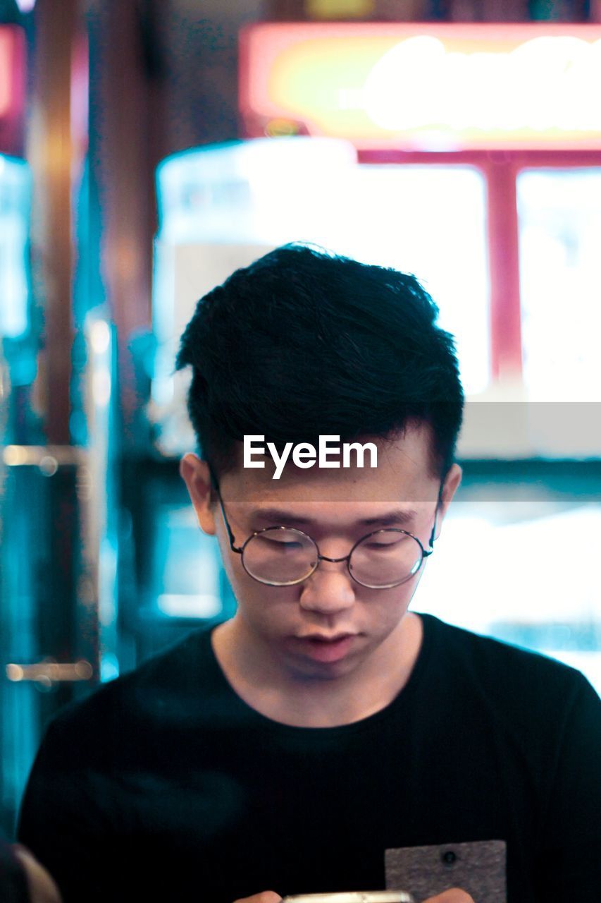 Close-up of young man wearing eyeglasses