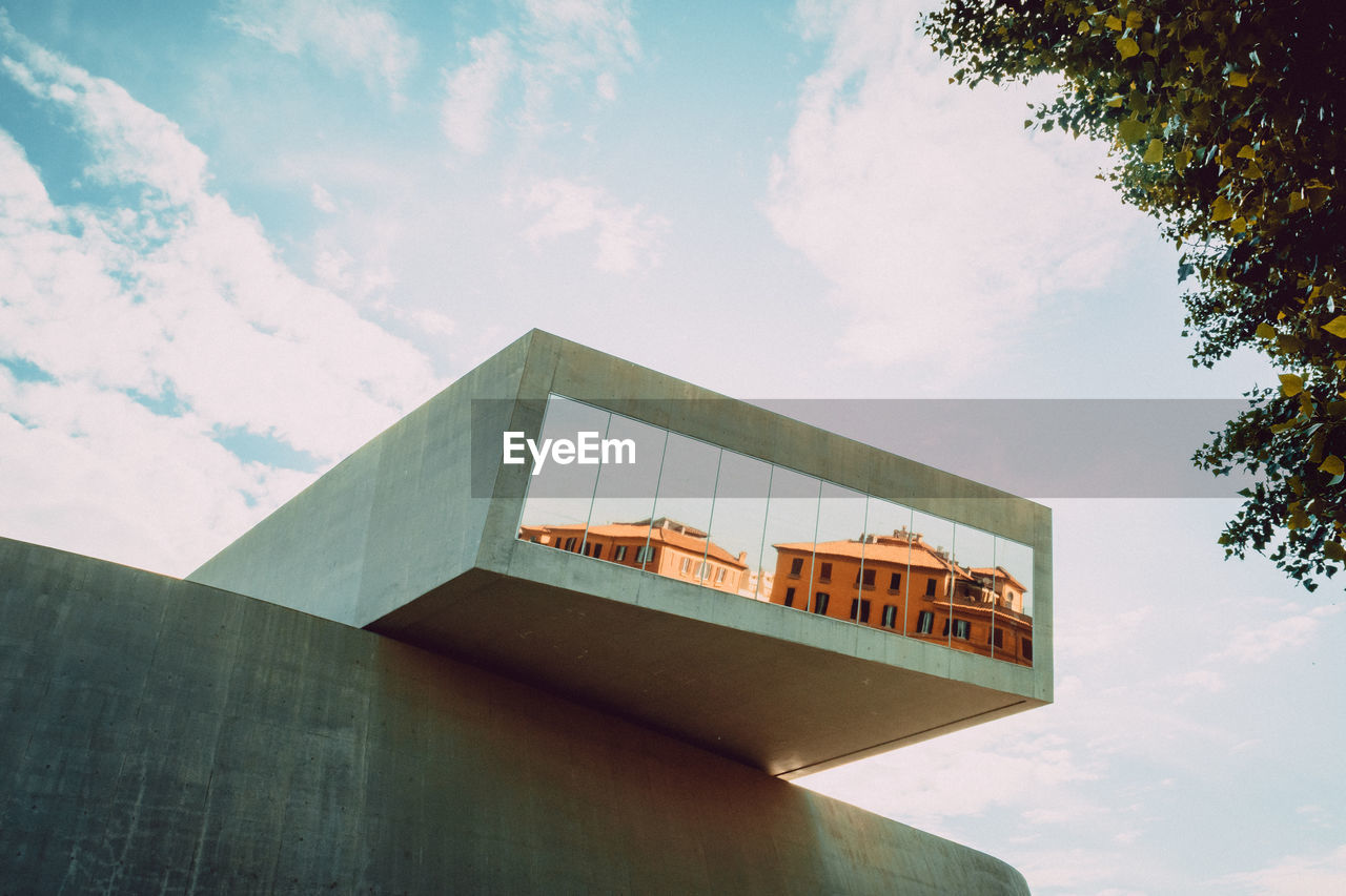 LOW ANGLE VIEW OF BUILT STRUCTURES AGAINST BLUE SKY