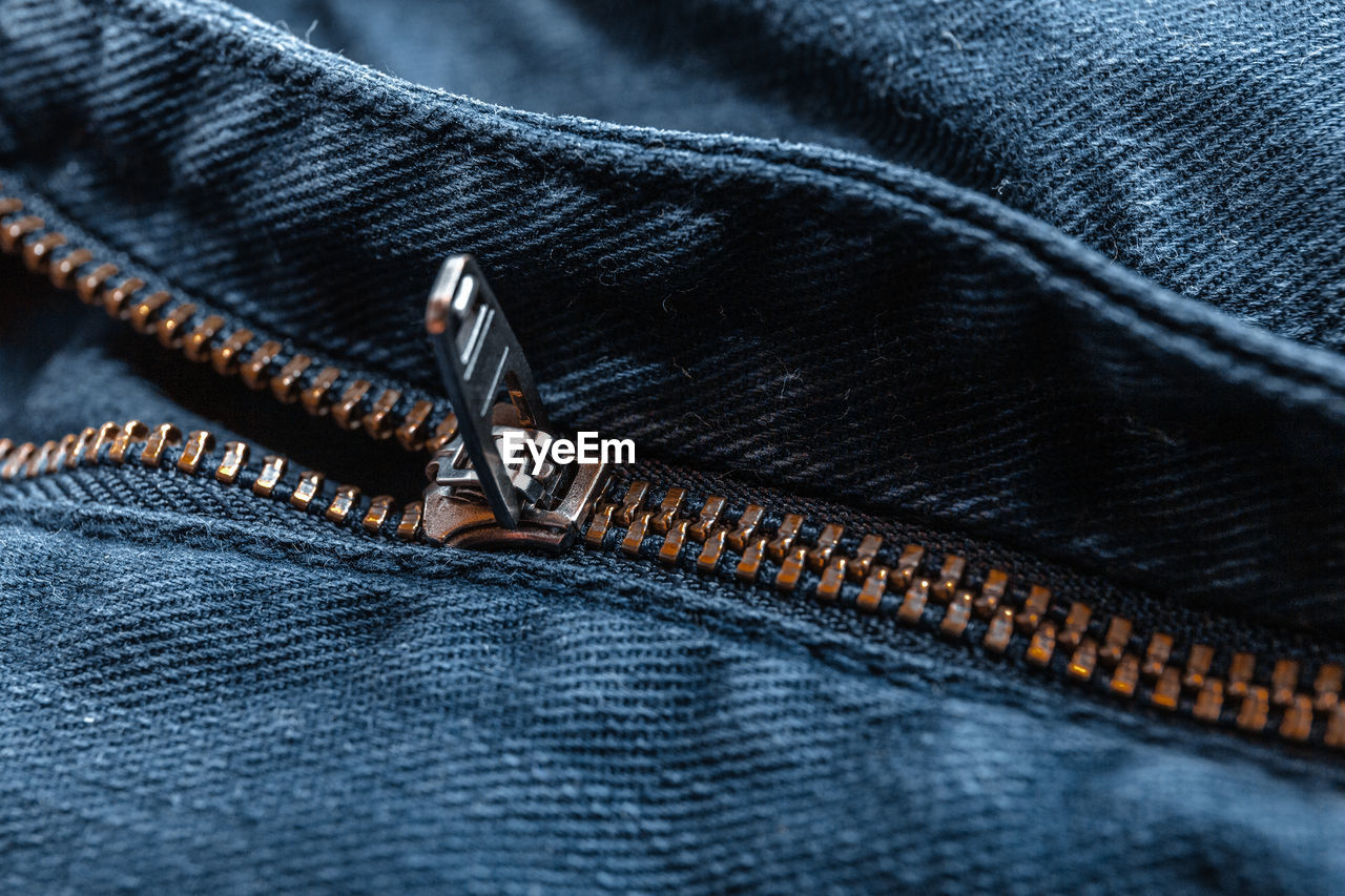 Close up of blue jeans zipper
