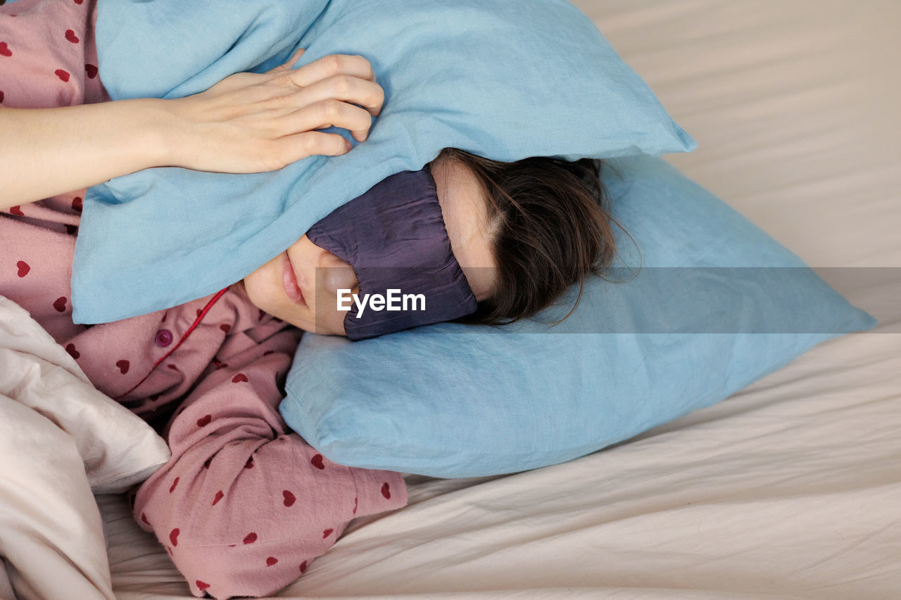 high angle view of cute baby girl sleeping on bed at home