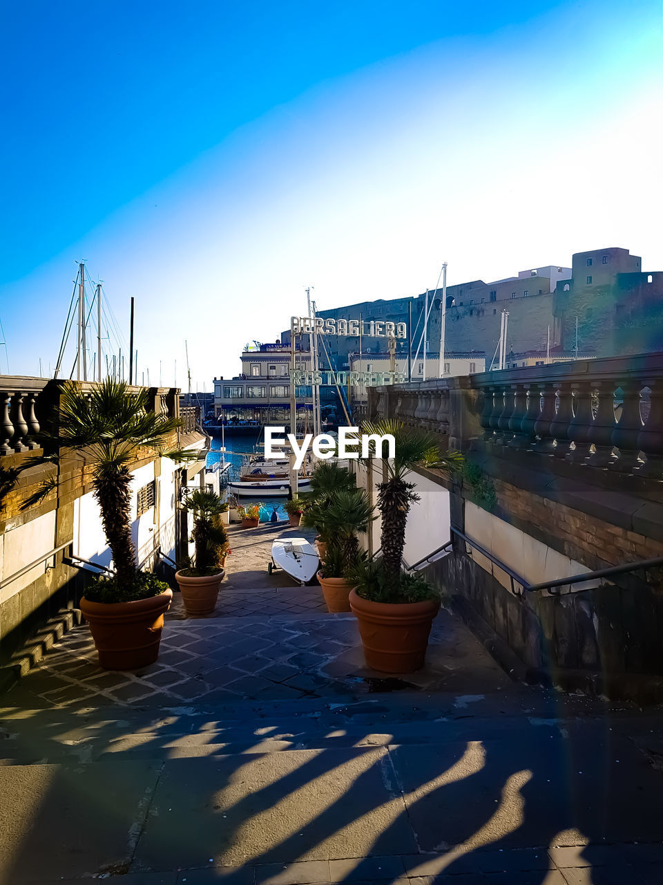 CANAL BY BUILDINGS AGAINST CLEAR SKY