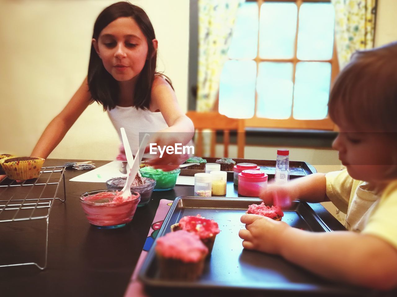 Siblings playing at home