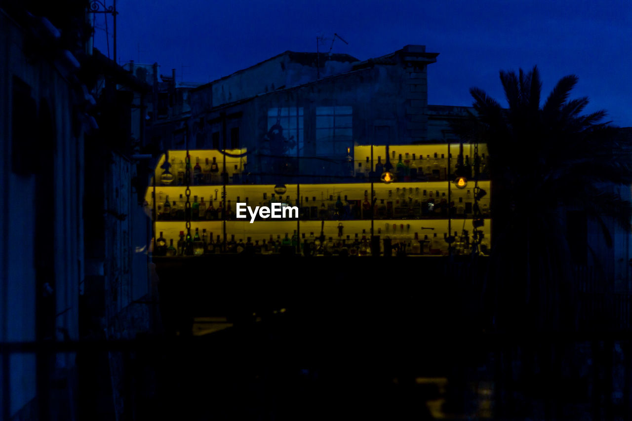 ILLUMINATED BUILT STRUCTURES AT NIGHT