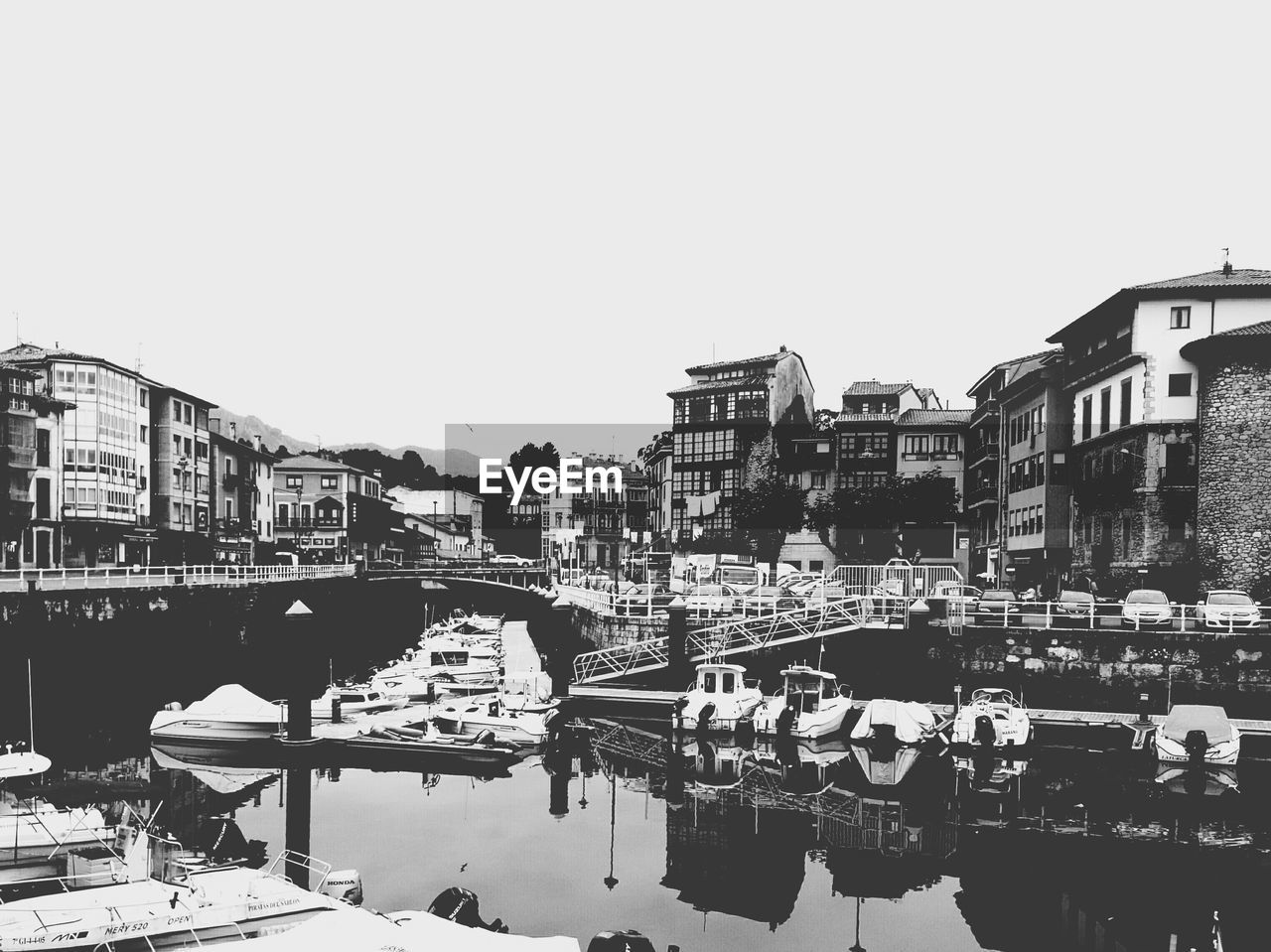 River amidst buildings against clear sky