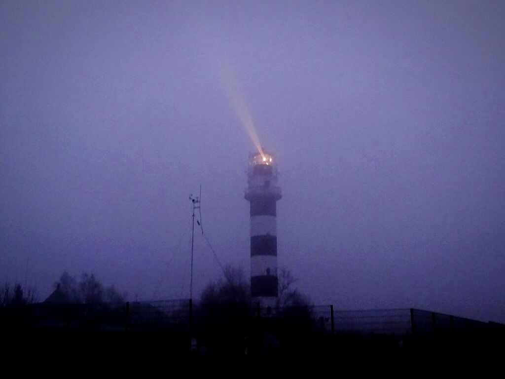 LOW ANGLE VIEW OF BUILT STRUCTURE AT SUNSET