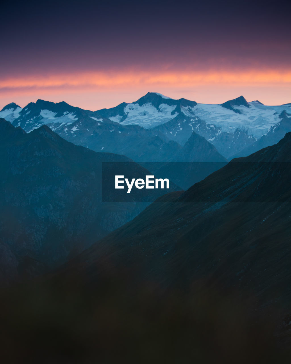 Scenic view of mountains against sky during sunset