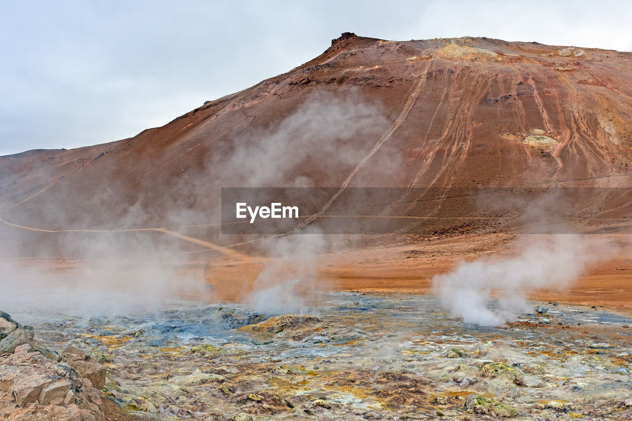 Impressive mt namafjall looming over the hverir thermal area in northern iceland