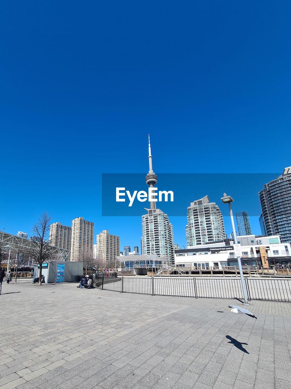 architecture, built structure, building exterior, city, sky, building, clear sky, travel destinations, blue, skyscraper, office building exterior, urban skyline, skyline, travel, landmark, cityscape, nature, landscape, tower, tourism, sunny, day, street, city life, office, downtown, outdoors, copy space, no people, residential district, horizon, sunlight, downtown district, business